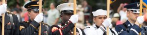 Joint services honor guard marching in a parade